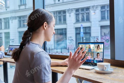 Preview: Video conference, laptop screen with group of students and teacher, teen girl in cafe