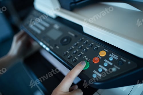 Preview: Hand on businesswoman using copy machine