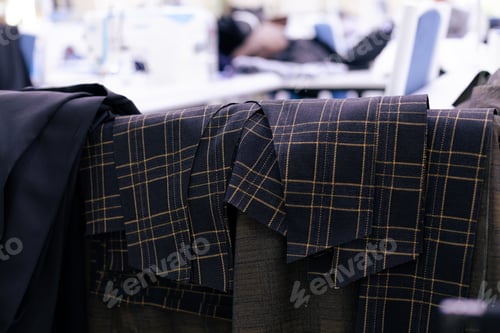 Preview: Suit Fabric Patterns Hang in Clothing Factory