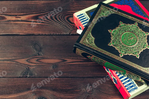 Preview: islamic holy book on wooden table. Creative photo