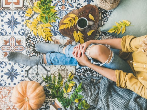 Preview: Female sitting on balcony with Autumn leaves, food, herbal tea