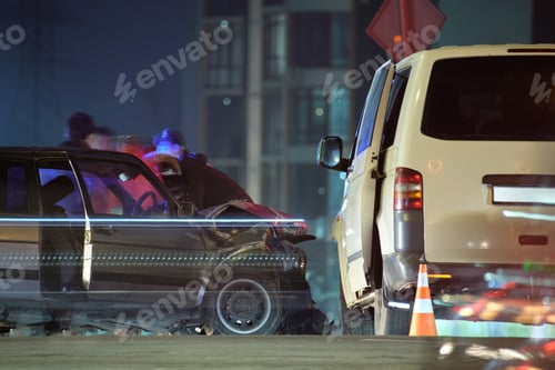 Preview: Damaged in heavy car accident vehicles after collision on city street crash site and silhouette of