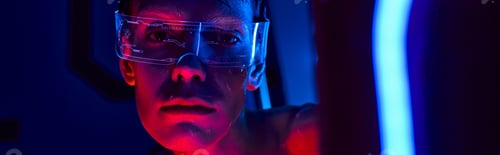 Preview: cosmic phenomenon, humanoid alien in goggles looking at camera in futuristic science center, banner