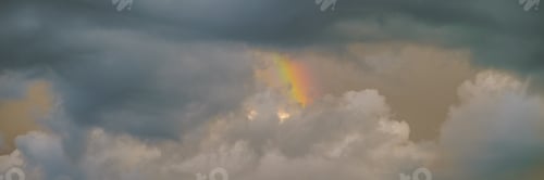 Preview: Rainbow in clouds during storm