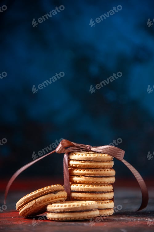 Preview: Vertical view of delicious stacked cookies on mix colors background with free space