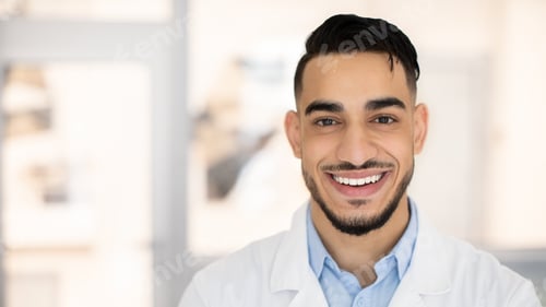 Preview: Closeup Portrait Of Smiling Young Middle Eastern Therapist Doctor In Uniform