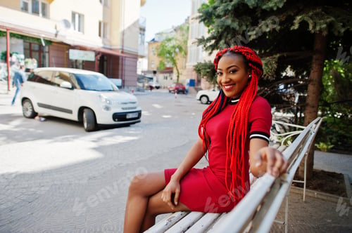 Preview: African american girl in red dress with dreadlocks
