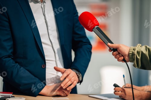 Preview: News reporters interviewing a public relations spokesperson.