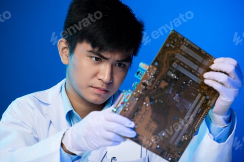 Preview: Engineer with circuit board