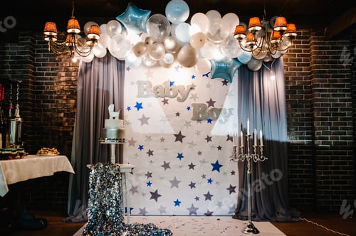 Preview: Birthday Cake on a background blue, white and silver balloons, brick wall. Baby shower party, decor