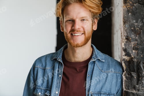 Preview: Happy handsome ginger guy smiling and looking at camera