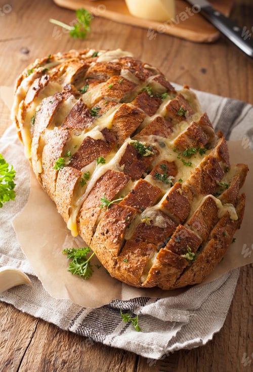 Preview: baked party bread with melted cheese butter herbs