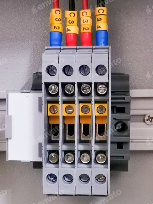 Preview: A row of terminal blocks in electrical cabinet.