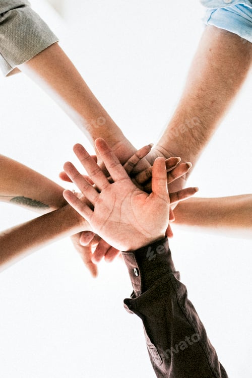 Preview: Diverse startup business team stacking hands