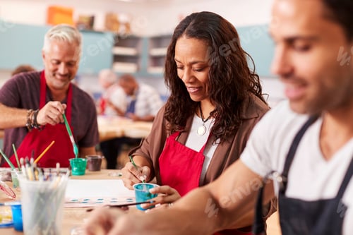 Preview: Group Of Mature Adults Attending Art Class In Community Centre