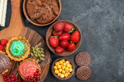 Preview: top view tasty creamy cakes with biscuits and fruits on dark background cookies sweet dessert