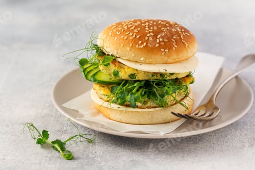 Preview: Healthy Vegetarian burger with egg and pea shoots and seeds microgreen, fresh salad, cucumber slice