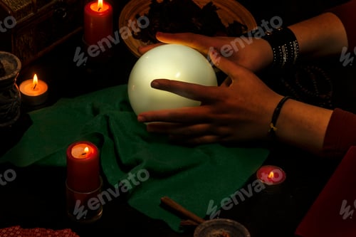 Preview: Pythoness reading the future in her hand on a crystal ball.