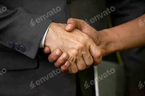 Preview: business team touching hands together after complete a deal in meeting.