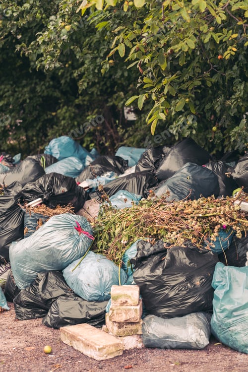 Preview: Vertical shot of a pile of trash bags - pollution concept