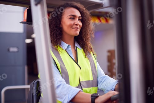 Preview: Female Worker Operating Fork Lift Truck At Freight Haulage Business