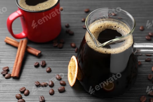 Preview: Turkish coffee in glass cezve and cup on grey wooden table. Space for text