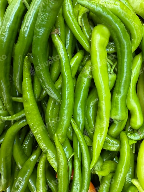 Preview: Green chili peppers creating vibrant background with fresh organic texture and natural pattern
