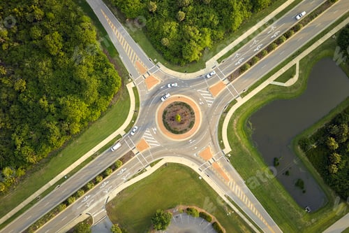 Preview: Aerial view of road roundabout intersection with moving cars traffic.