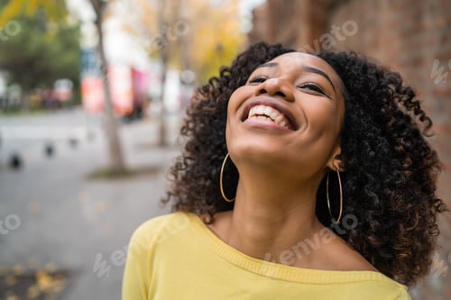 Preview: Portrait of Afro-american woman laughing.