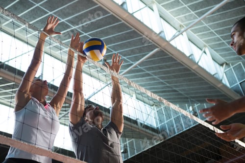 Preview: Low angle view of players practicing volleyball