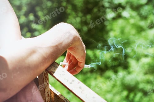 Preview: Arm Leaning on Railing with Smoking Cigarette