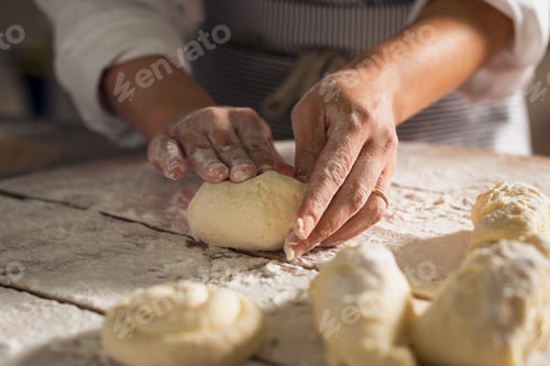 Preview: Baker hands preparing bread loaves kneading dough