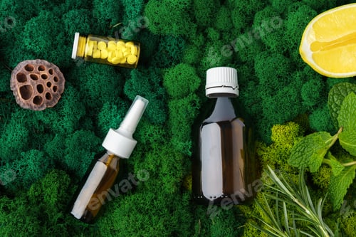 Preview: Set of brown glass bottles beauty products on moss background