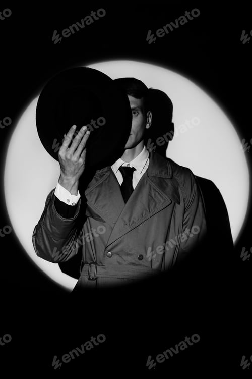 Preview: A dark silhouette of a male detective in a coat and hat in the noir style.