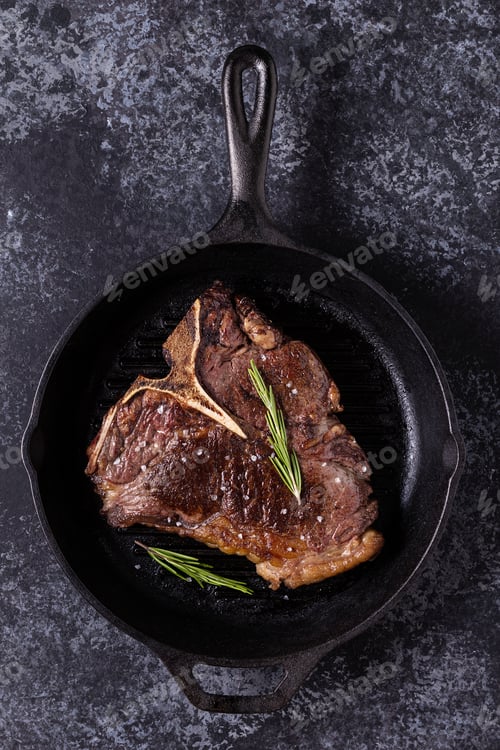 Preview: Grilled beef steak with spices in a frying pan