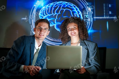 Preview: Two professionals collaborate on innovative technology while showcasing brain graphics