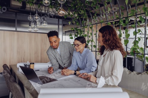 Preview: Engaging in a Collaborative Team Meeting within a Modern and Innovative Workspace Setting