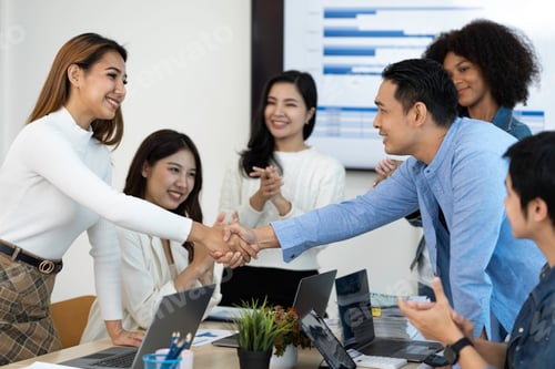 Preview: business team celebrates corporate victory together in the office, happy overjoyed professionals gro