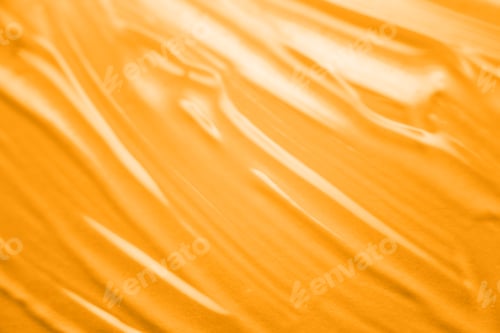 Preview: Abstract texture. Liquid gel cosmetics. Yellow background.