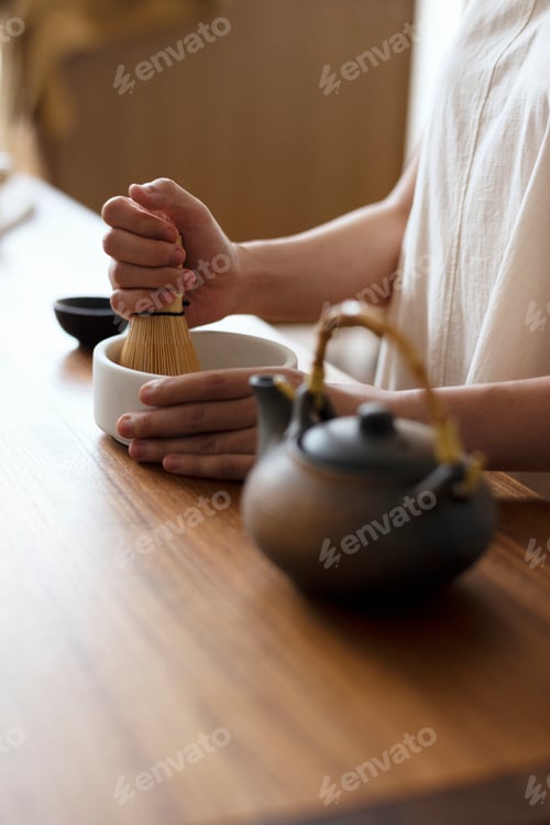 Preview: Japanese woman preparing matcha green tea