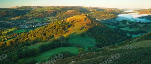 Preview: Panoramic view of the Castell Dinas Bran, Llangollen in the Welsh valley at dawn