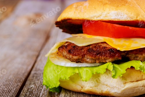 Preview: Homemade delicious fresh burger on a on rustic wooden table