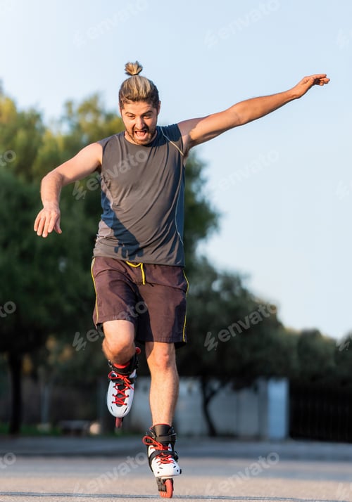 Preview: Man jumping while skating with inline skates outdoors