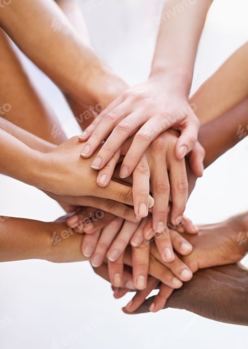 Preview: Showing solidarity. Shot of a group of people putting their hands together.