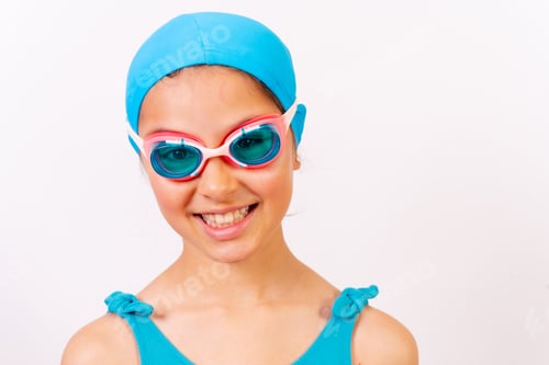 Preview: Portrait of girl with swimsuit and diving goggles for swimming lessons in the pool in summer