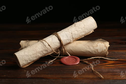 Preview: Old rolled paper scrolls on wooden table, closeup