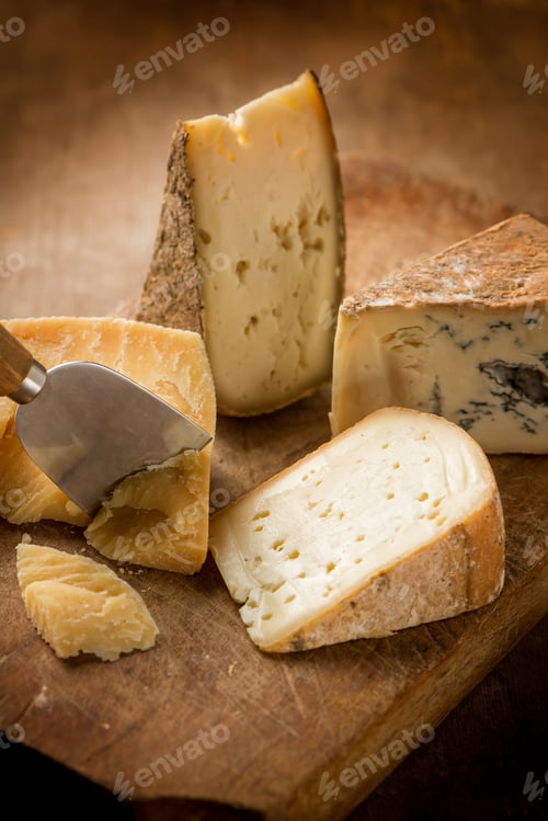 Preview: variety of traditional italian cheese over cutting board