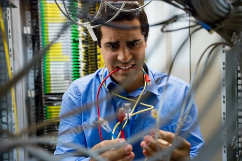 Preview: Frustrated Technician Fixing Cable In Server Room