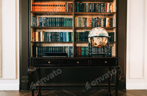 Preview: Big wooden vintage globe in a table near bookshelf in library.