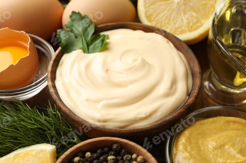 Preview: Wooden bowl of mayonnaise and ingredients for cooking